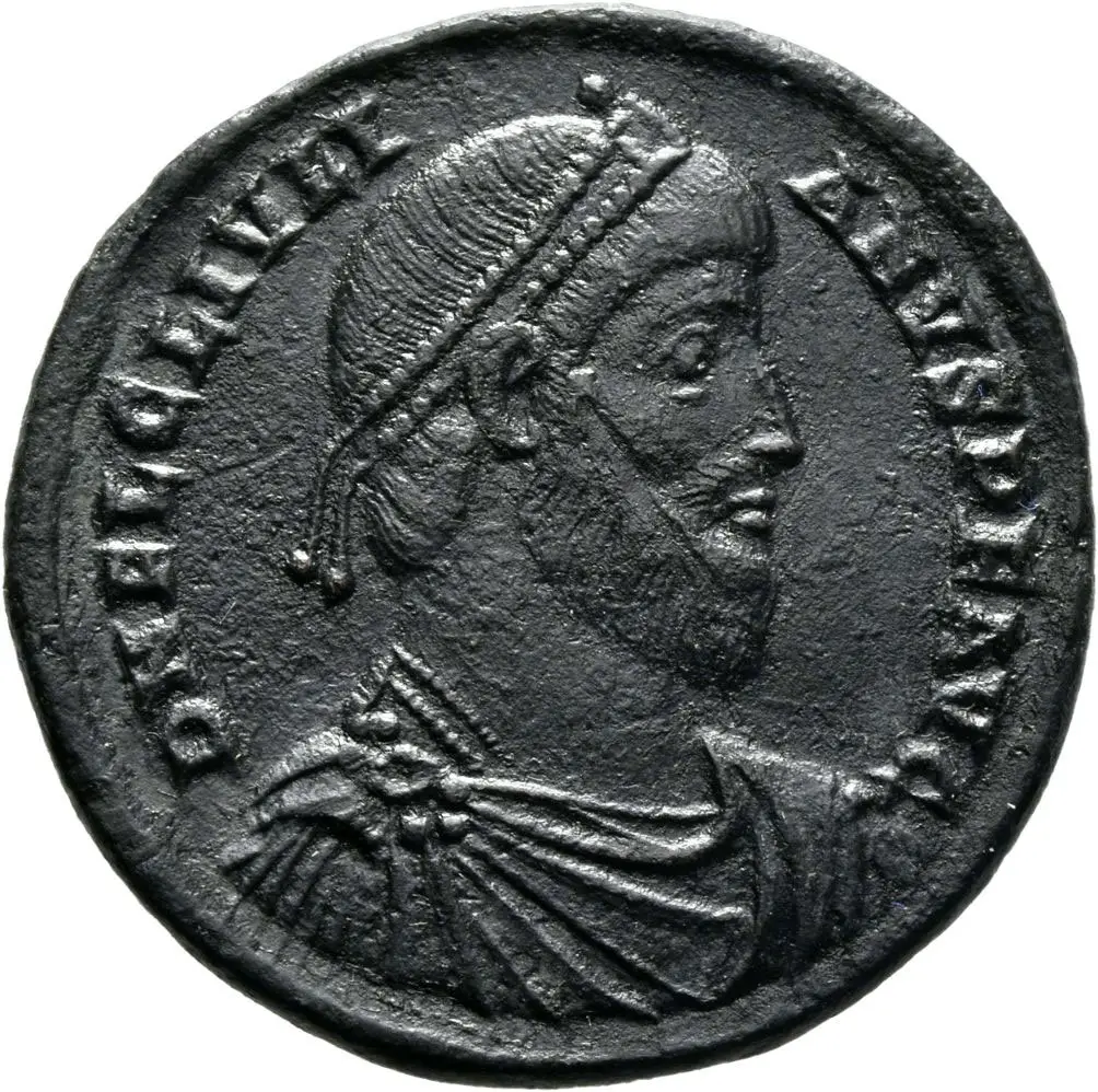 Münze mit geprägtem Kopf und um den Rand laufender Schrift